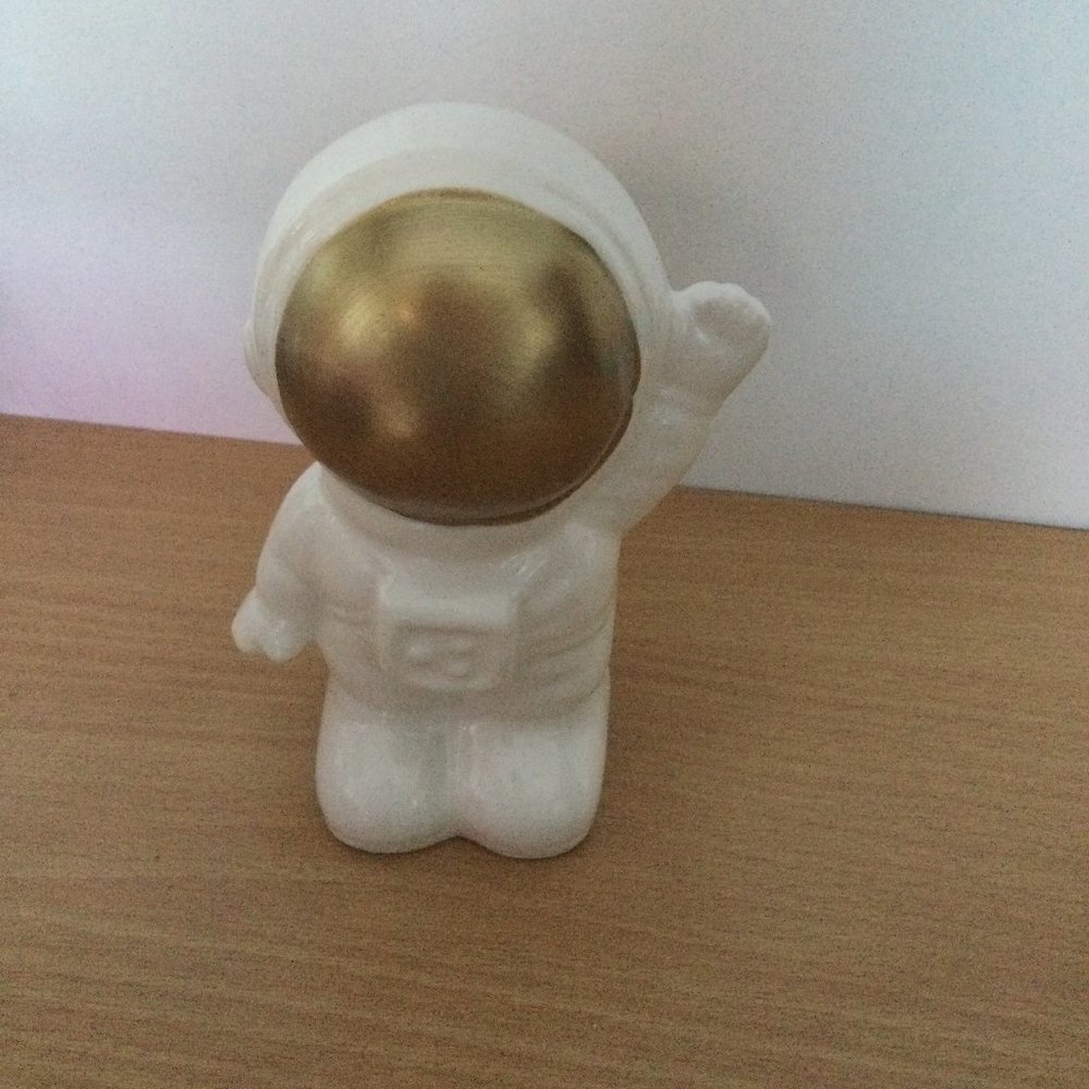 White ceramic astronaut figurine coin bank Greenbrier International Inc